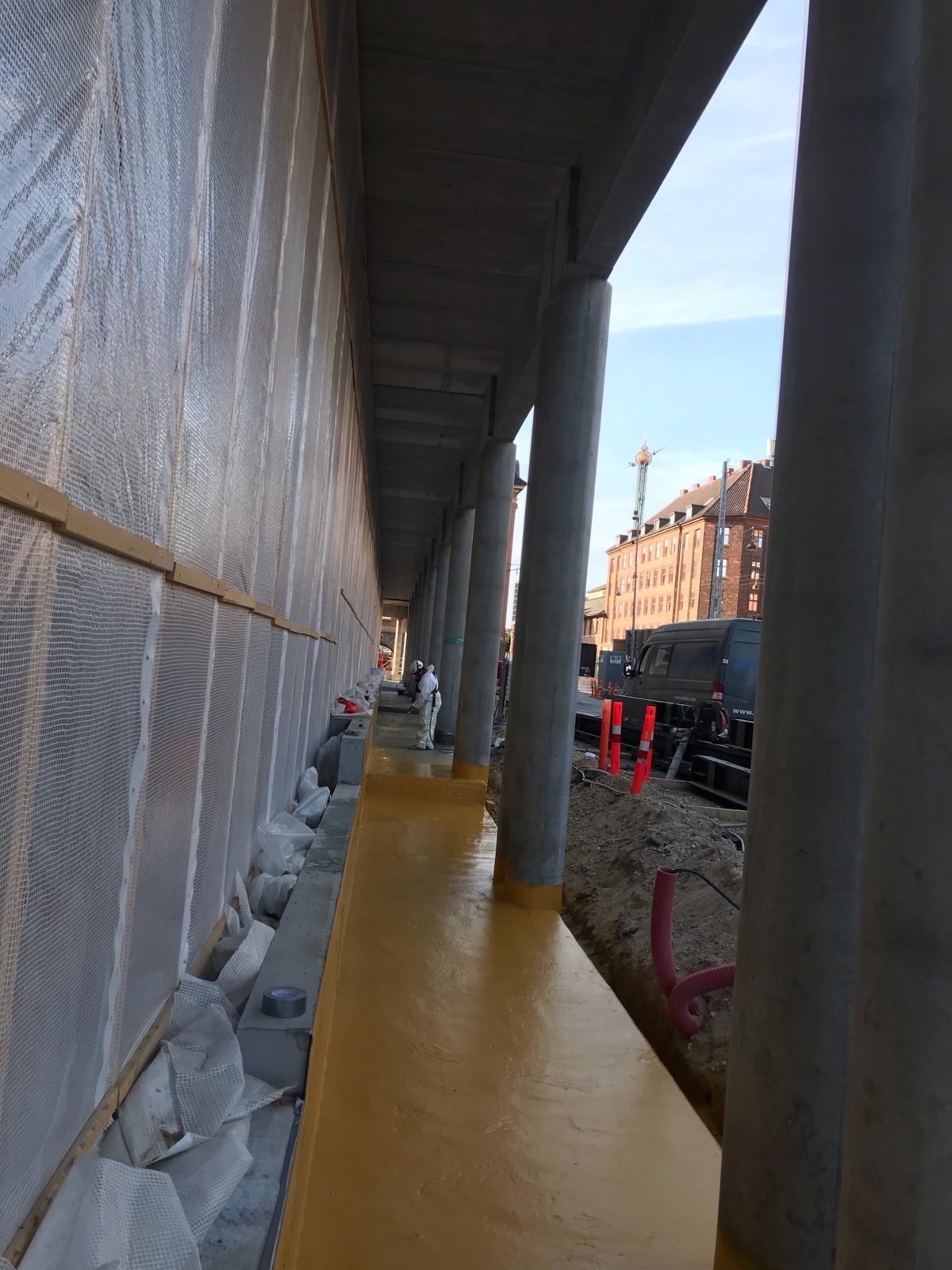 Yellow first coat of Type V on the podium deck at Danske Bank's headquarters