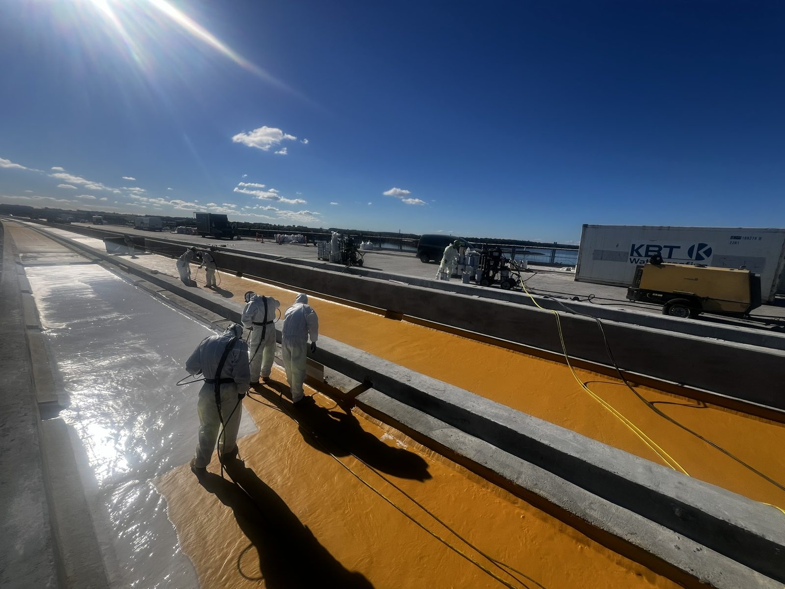 KBT applicators spraying the yellow Eliminator layer on the railway section of the Storstrøm Bridge, October 2024